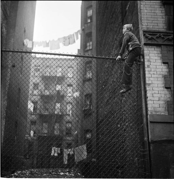 buildings-and-heights-are-another-repeated-theme-in-kubricks-photography-thats-a-shoeshine-boy-on-the-fence